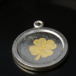 Variations of the fleural motif on a silver pendant