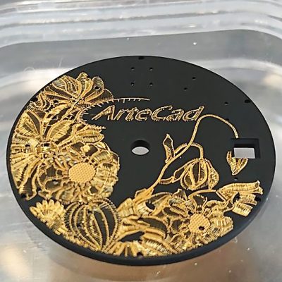 Flower motif, gold thread on black lacquered base